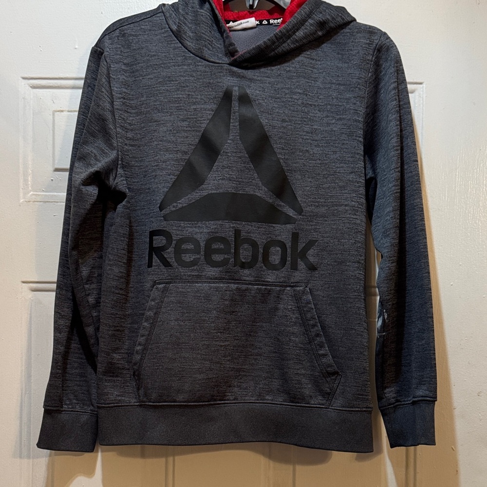Reebok Charcoal Hoodie with Black Logo. Only issue is paint on left arm